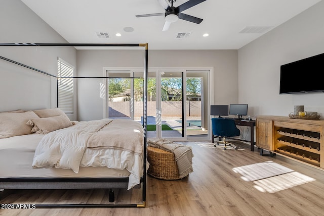 bedroom featuring ceiling fan, access to exterior, and hardwood / wood-style floors