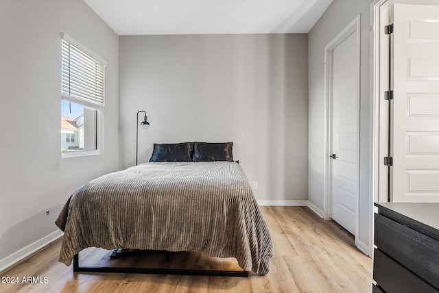 bedroom with light hardwood / wood-style floors