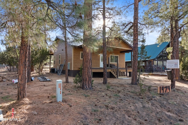 view of front of home with cooling unit