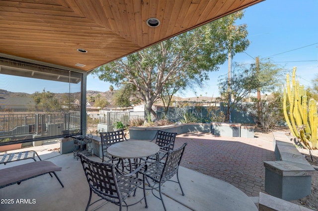 view of patio / terrace featuring a mountain view