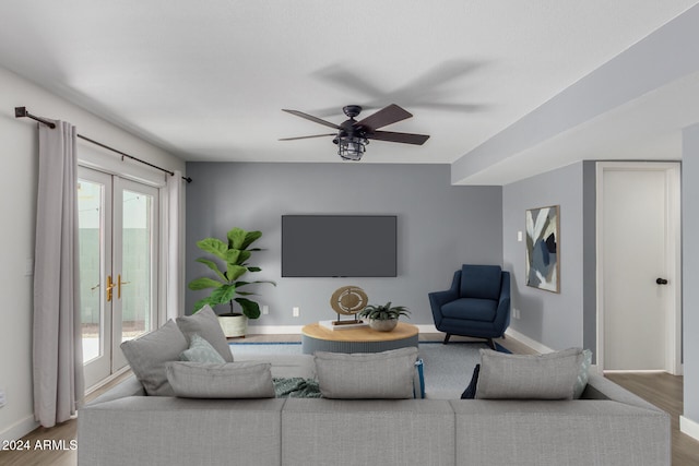 living room with hardwood / wood-style flooring, ceiling fan, a healthy amount of sunlight, and french doors