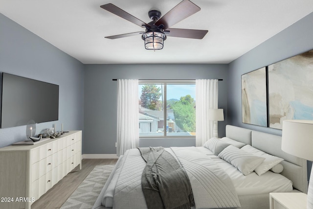 bedroom featuring ceiling fan and light wood-type flooring