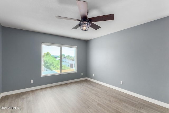 spare room featuring ceiling fan and wood-type flooring