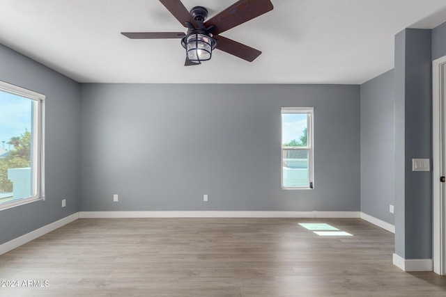 empty room featuring ceiling fan and light wood-type flooring