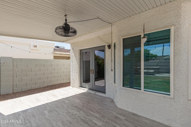 view of patio / terrace featuring ceiling fan and french doors