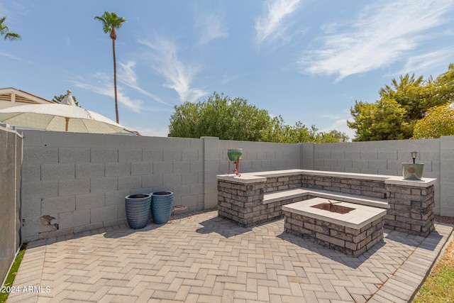 view of patio / terrace with a fire pit