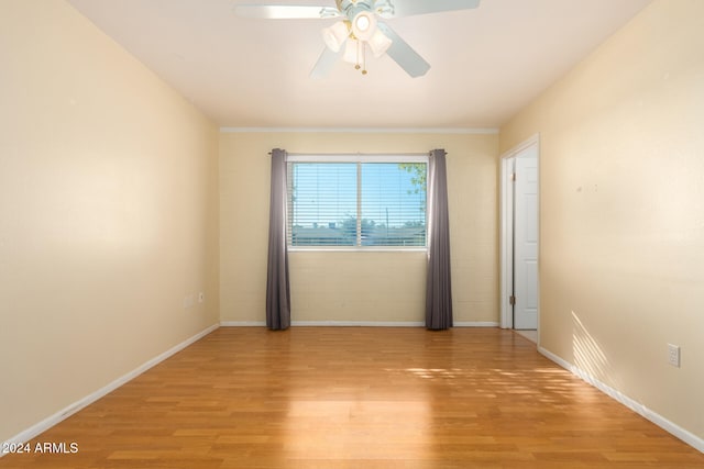 unfurnished room featuring light wood-type flooring and ceiling fan