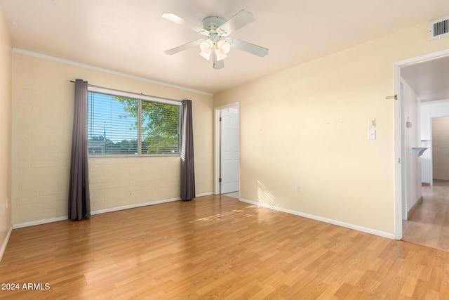 unfurnished room with ceiling fan and light hardwood / wood-style floors