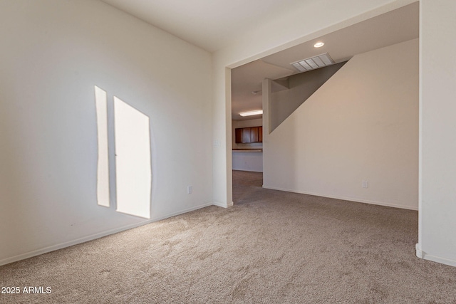 empty room featuring carpet floors