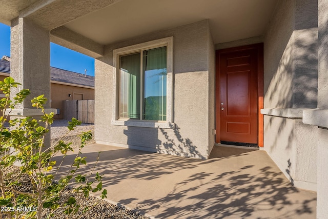 doorway to property with a patio