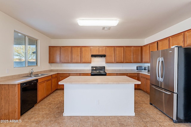 kitchen with a kitchen island, sink, and black appliances