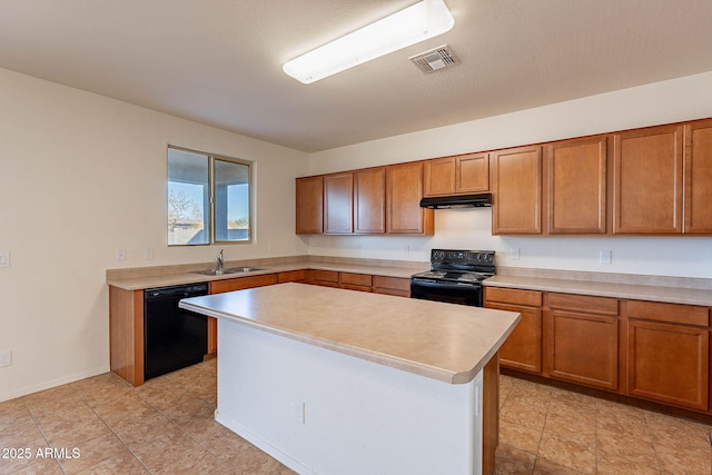 kitchen featuring a kitchen island, sink, and black appliances