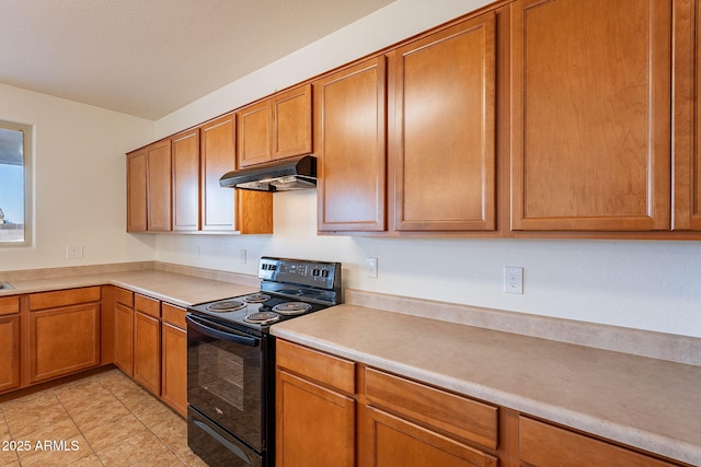 kitchen with light tile patterned floors and black electric range