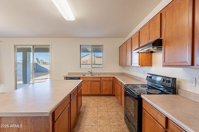 kitchen featuring sink, black electric range oven, and a kitchen island