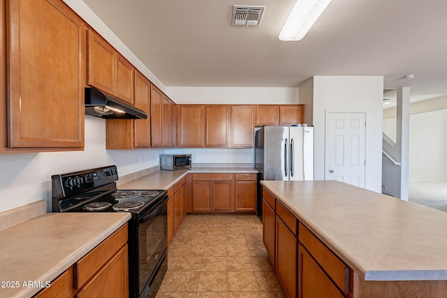 kitchen featuring stainless steel appliances and a center island