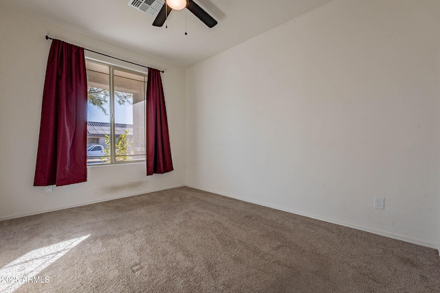 empty room with ceiling fan and carpet flooring