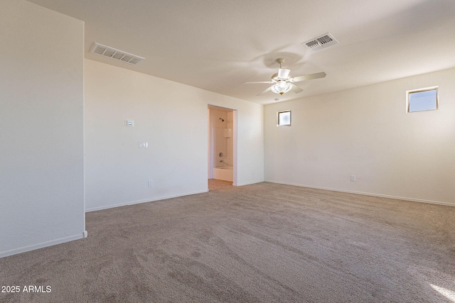 unfurnished room with ceiling fan, carpet, and plenty of natural light