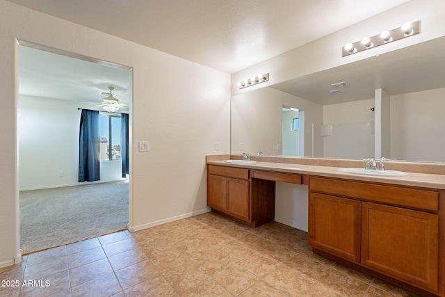 bathroom featuring ceiling fan and vanity