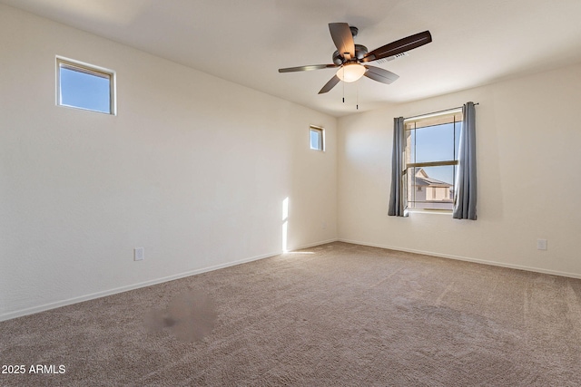 carpeted empty room with ceiling fan