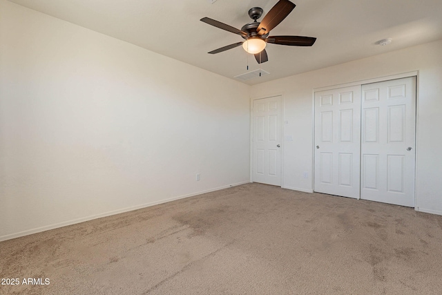 unfurnished bedroom with ceiling fan, a closet, and carpet floors