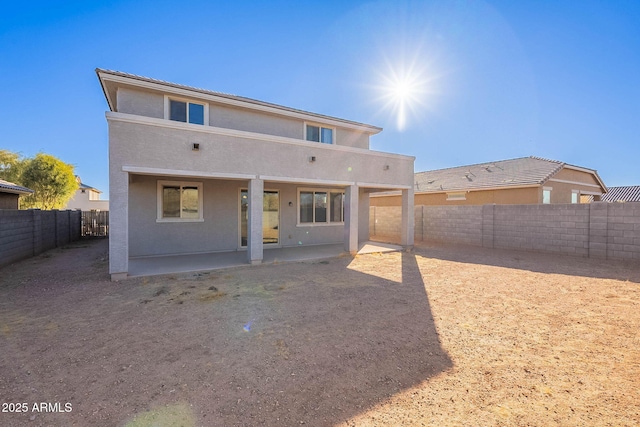 rear view of property featuring a patio area