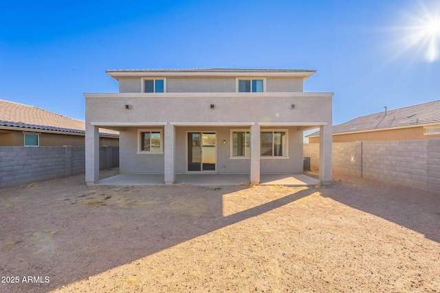 back of property with a patio area