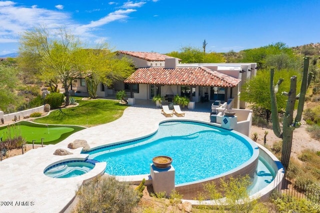 view of pool with a pool with connected hot tub and a patio