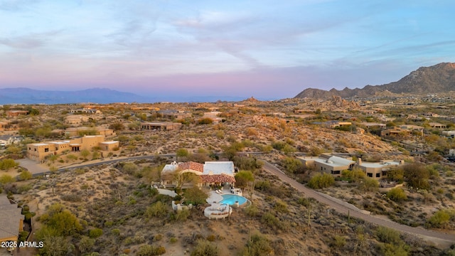 birds eye view of property with a mountain view