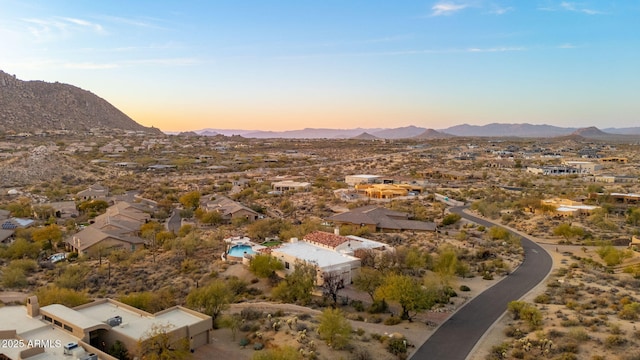 drone / aerial view featuring a residential view and a mountain view