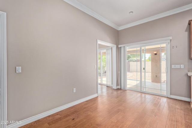 3034 E Turney Ave, Phoenix, AZ 85016 - empty room featuring baseboards, light wood-style floors, and ornamental molding