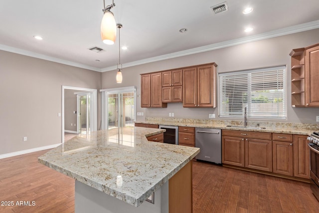 3034 E Turney Ave, Phoenix, AZ 85016 - kitchen with a sink, stainless steel appliances, brown cabinets, decorative light fixtures, and beverage cooler