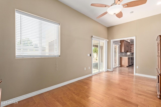 3034 E Turney Ave, Phoenix, AZ 85016 - spare room featuring a ceiling fan, light wood finished floors, and baseboards