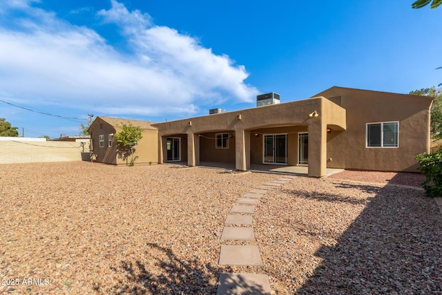 3034 E Turney Ave, Phoenix, AZ 85016 - back of house featuring stucco siding and a patio