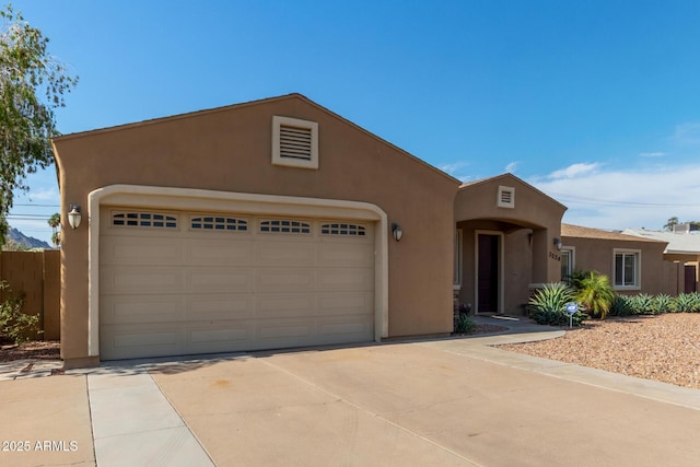 3034 E Turney Ave, Phoenix, AZ 85016 - view of front of house with stucco siding and driveway