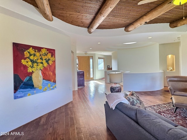 living room featuring wood-type flooring, beamed ceiling, and wooden ceiling