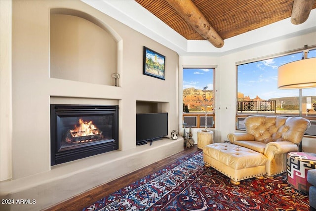 living room with hardwood / wood-style floors, beamed ceiling, and wood ceiling