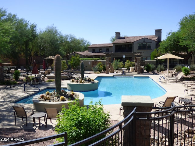 view of swimming pool featuring a patio