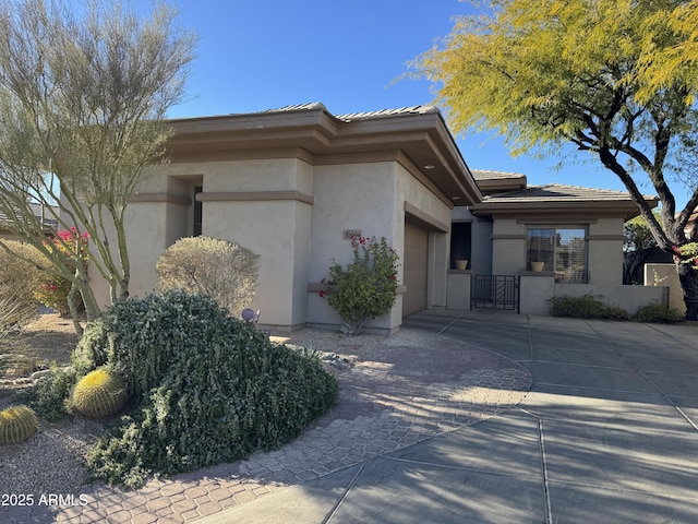 view of exterior entry with a garage