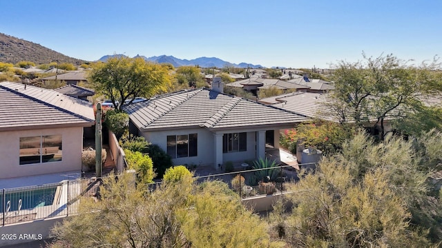 birds eye view of property featuring a mountain view