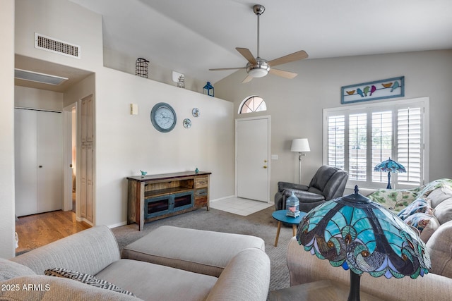 14300 W Bell Rd Unit 312, Surprise, AZ 85374 - carpeted living room with high vaulted ceiling and a ceiling fan