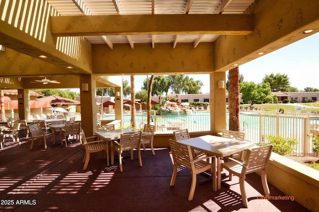 14300 W Bell Rd Unit 312, Surprise, AZ 85374 - view of patio / terrace with outdoor dining area, a community pool, and a ceiling fan