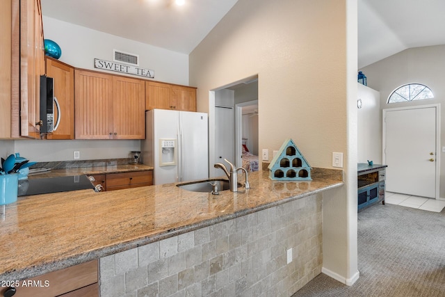 14300 W Bell Rd Unit 312, Surprise, AZ 85374 - kitchen featuring white fridge with ice dispenser, a sink, stainless steel microwave, range, and carpet