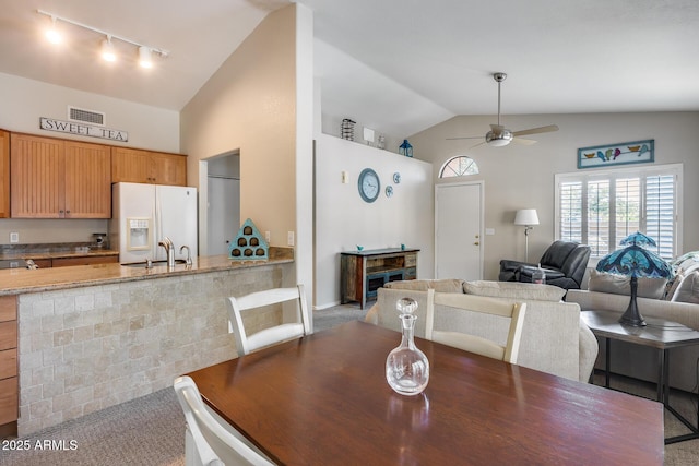 14300 W Bell Rd Unit 312, Surprise, AZ 85374 - dining space featuring track lighting, a ceiling fan, and high vaulted ceiling