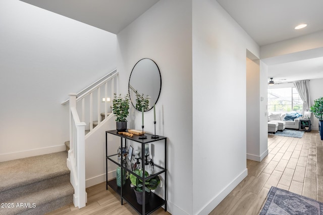 21241 E Superstition Dr, Queen Creek, AZ 85142 - hallway featuring stairs, light wood-style flooring, recessed lighting, and baseboards