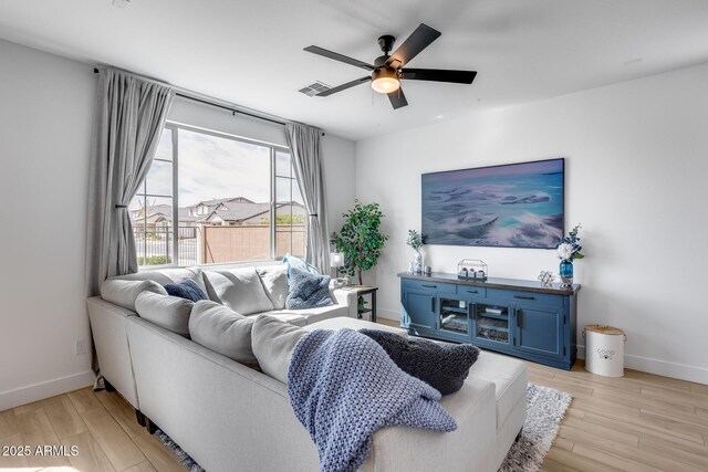 21241 E Superstition Dr, Queen Creek, AZ 85142 - living area featuring visible vents, light wood-style floors, baseboards, and ceiling fan