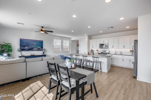 21241 E Superstition Dr, Queen Creek, AZ 85142 - dining area with light wood-style flooring, recessed lighting, a ceiling fan, and visible vents