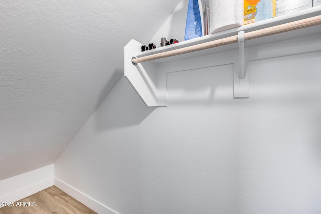 21241 E Superstition Dr, Queen Creek, AZ 85142 - spacious closet with lofted ceiling and light wood finished floors