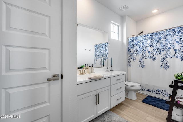 21241 E Superstition Dr, Queen Creek, AZ 85142 - bathroom featuring vanity, a shower with shower curtain, wood finished floors, visible vents, and toilet
