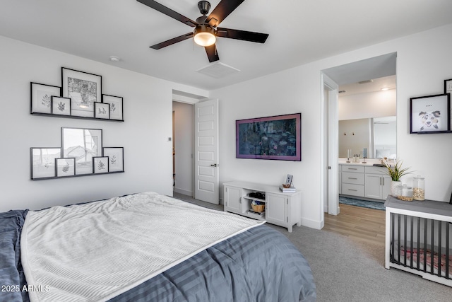 21241 E Superstition Dr, Queen Creek, AZ 85142 - bedroom featuring connected bathroom, a ceiling fan, baseboards, and light carpet