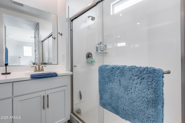 21241 E Superstition Dr, Queen Creek, AZ 85142 - bathroom featuring visible vents, a stall shower, and vanity